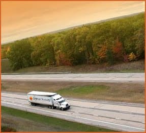 truck fleet driving on highway in florida with nice scenery
